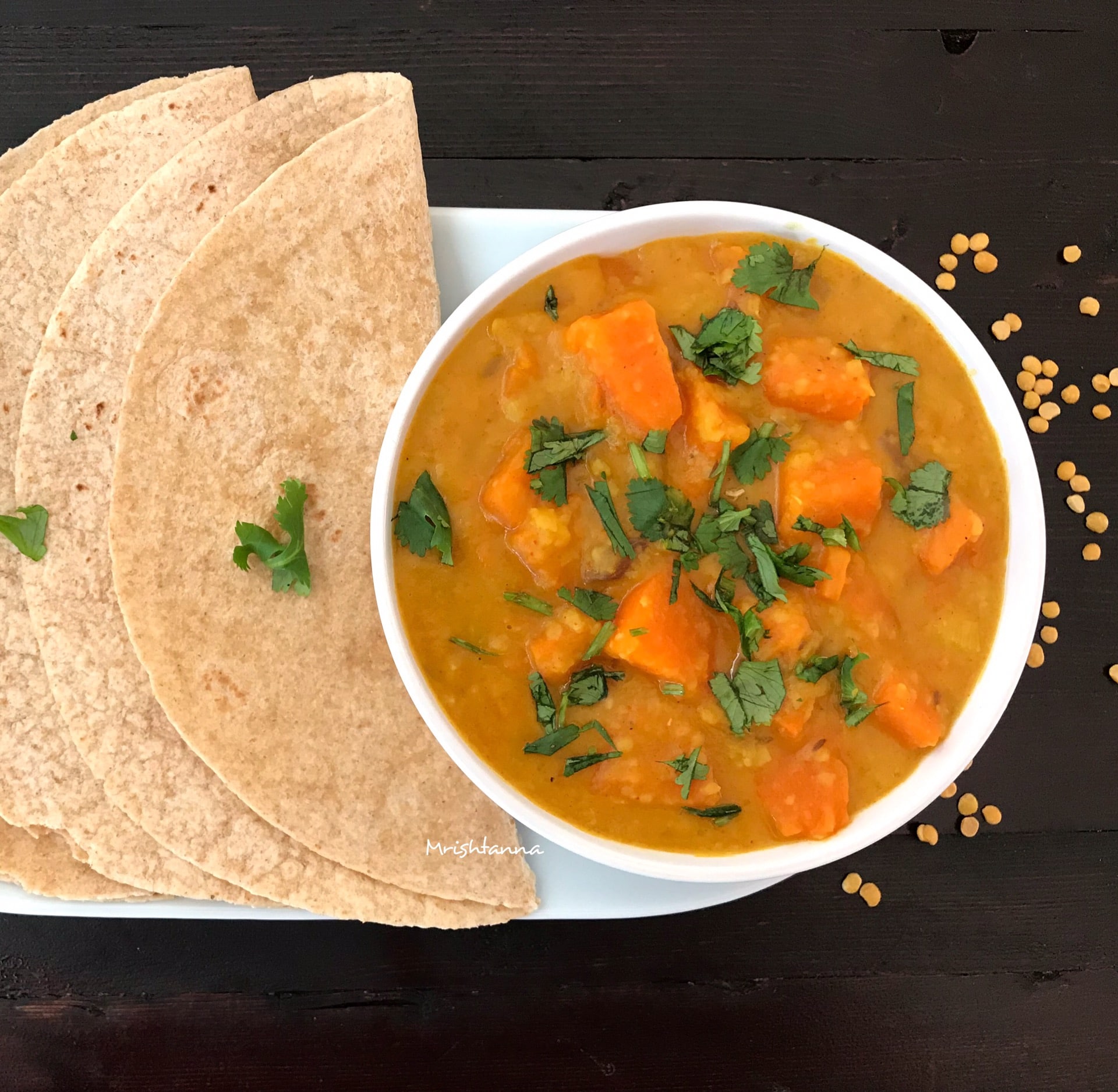 Low Fat Pumpkin Dal A bowl of soup on a table, with Dal and Curry