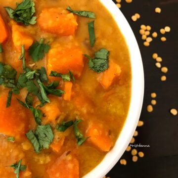 Pumpkin dal is in the white bowl