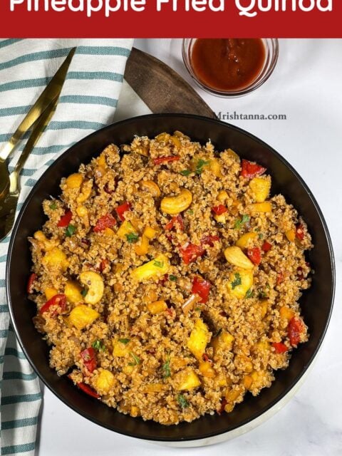 A plate is filled with quinoa with pineapple.