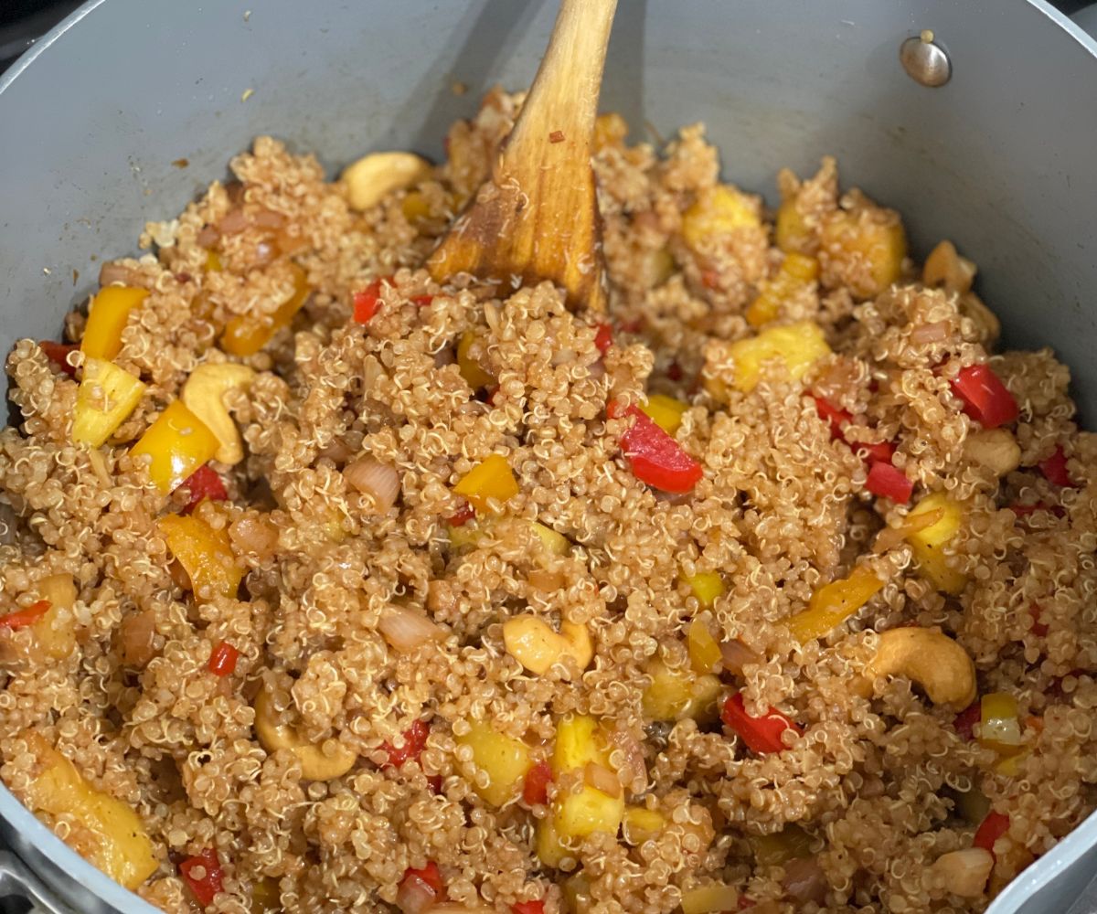 A pot is with pineapple fried quinoa.
