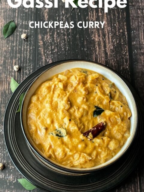 A bowl is filled with cabbage and chickpeas gassi and is on the table