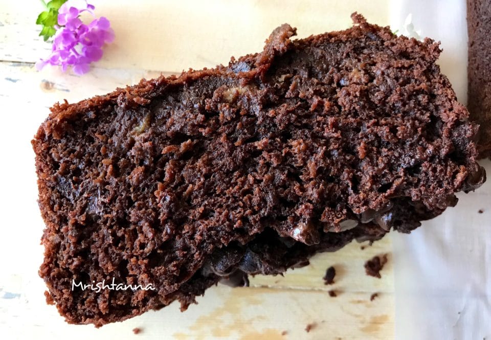 A piece of chocolate cake on a plate, with Banana 