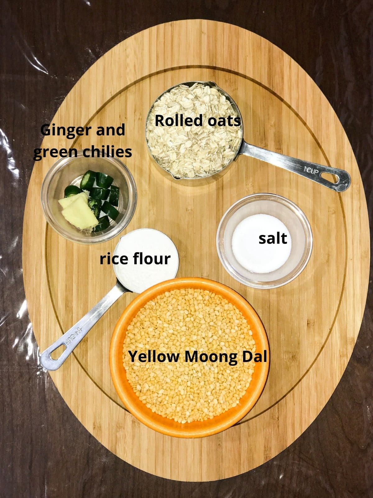 Bowls of ingredients like moong dal, oats and ginger are placed on the serving tray