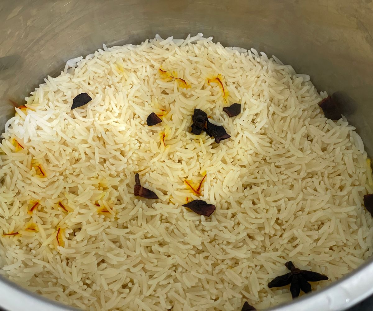 An Instant pot is with cooked basmati rice.