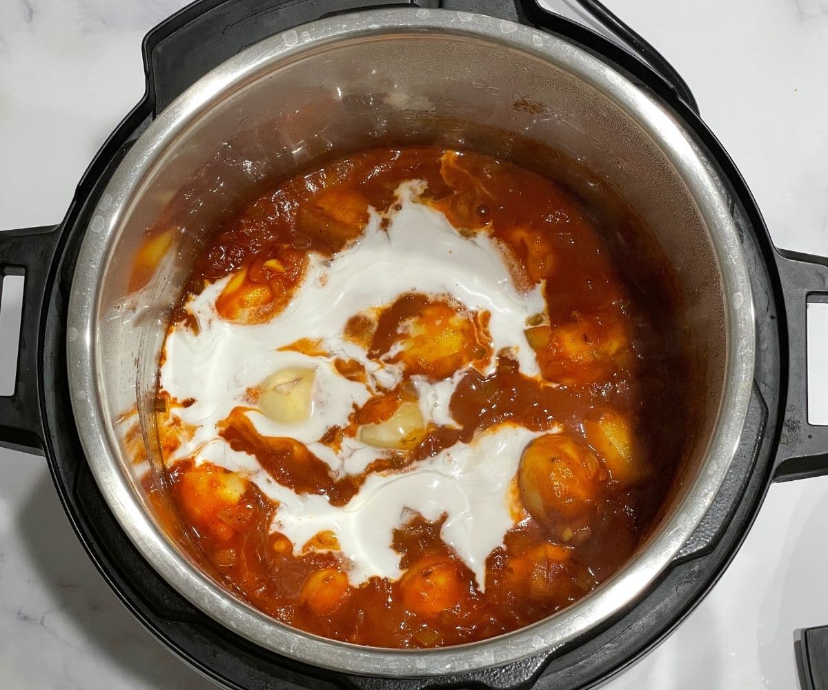 A pot is with dum aloo masala.