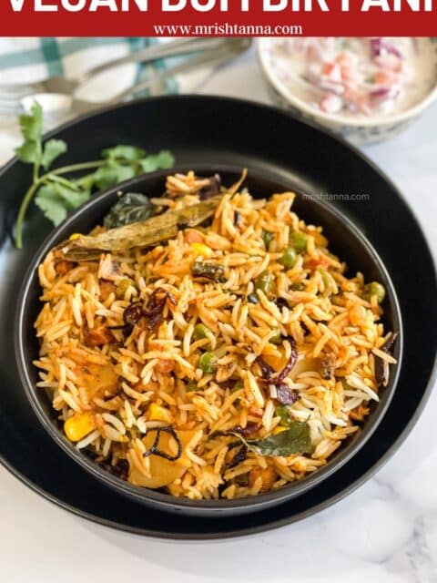 A bowl has full of Vegan Dum Biryani.