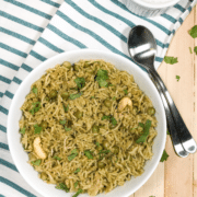 A bowl of food on a plate, with Pea and Rice