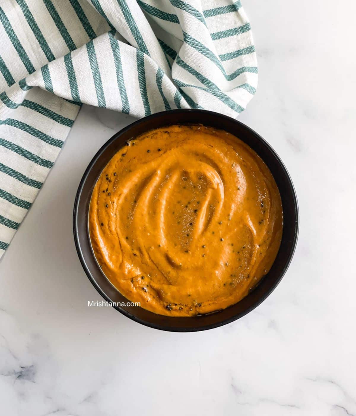 Head shot of bowl with capsicum tomato chutney.