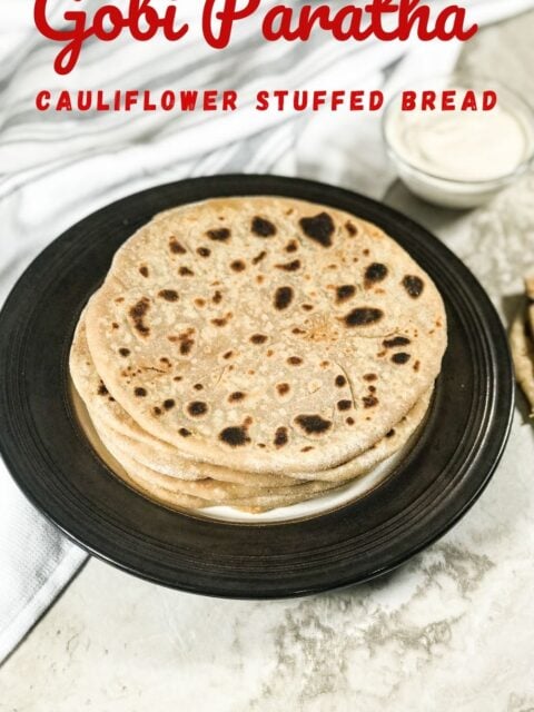 A plate of cauliflower paratha is on the table