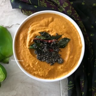 A bowl of food on a plate, with Chutney