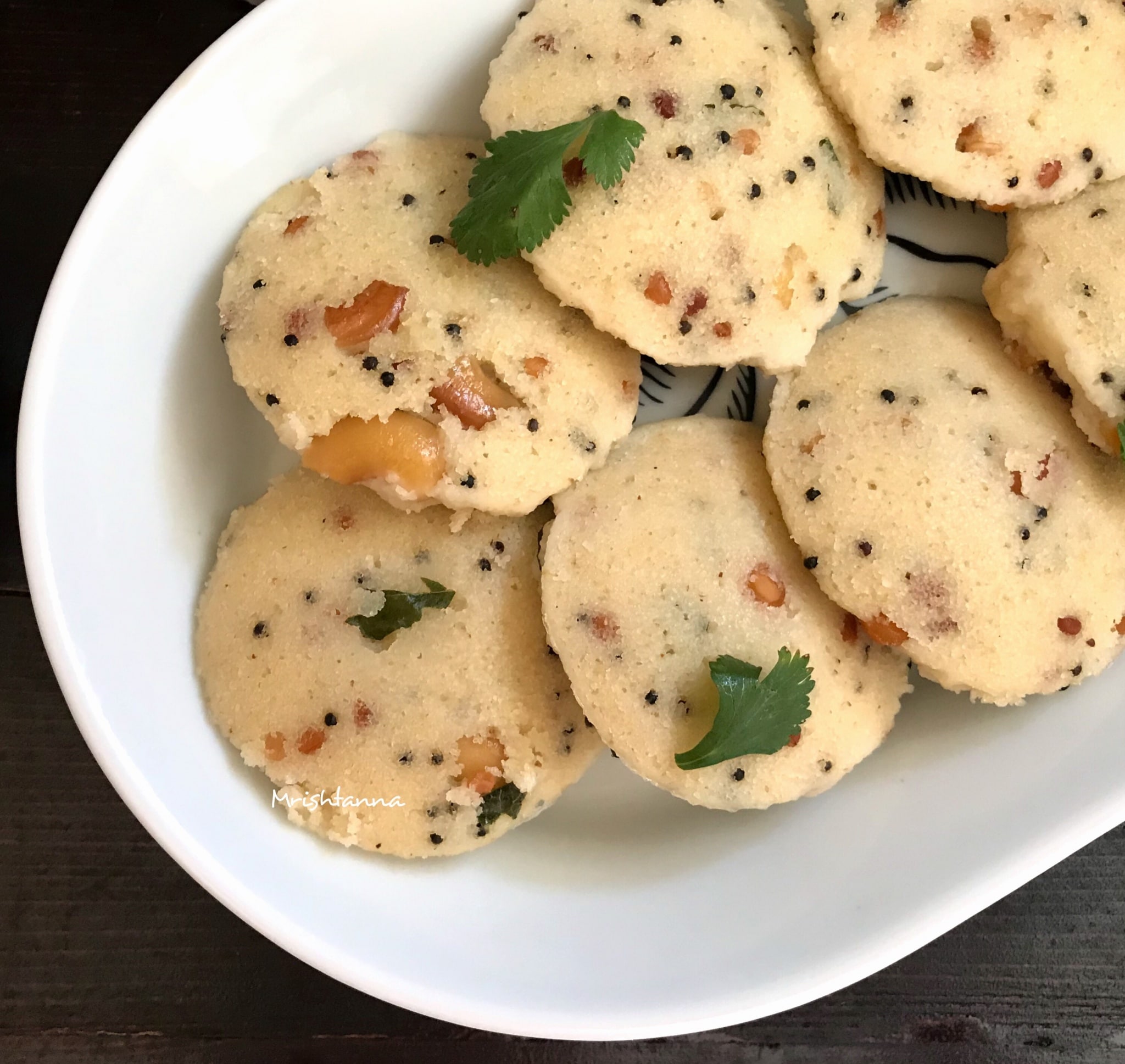 A plate of food, with Rava idli