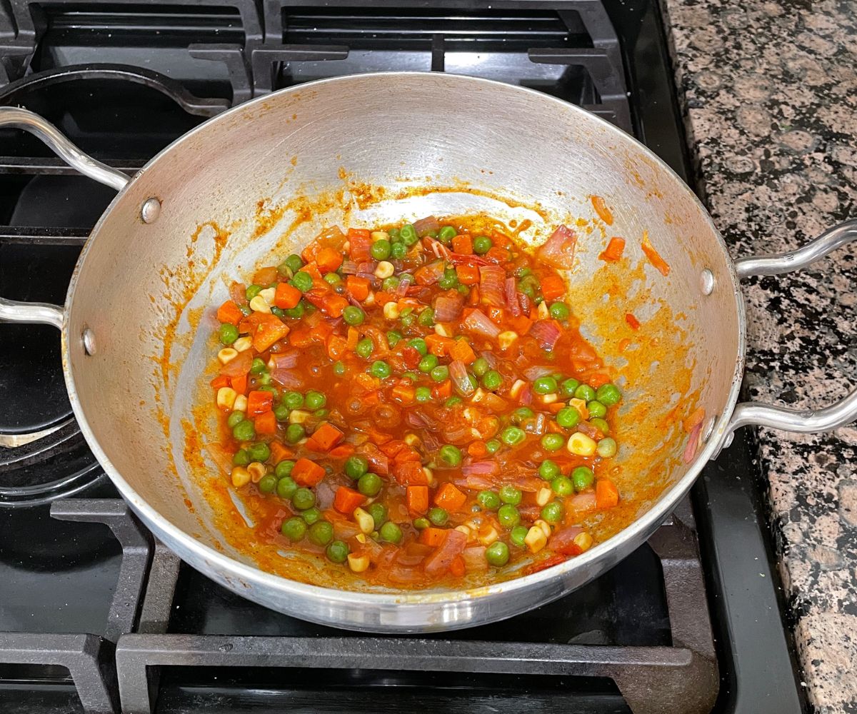 A pot is with masala pasta sauce over the heat.