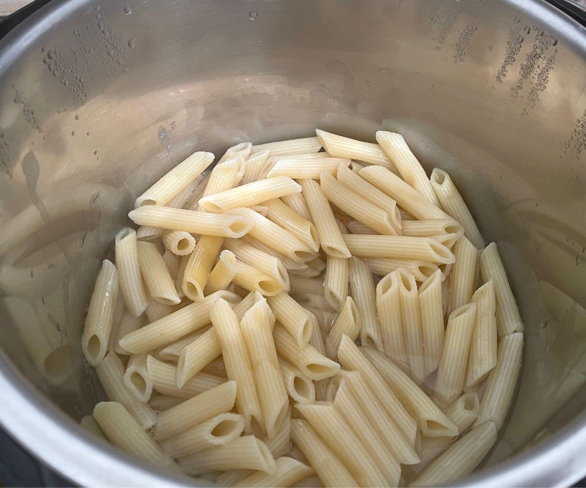 Cooked pasta is inside the instant pot.
