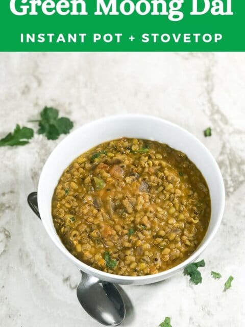 A bowl of green moong dal is on the white table