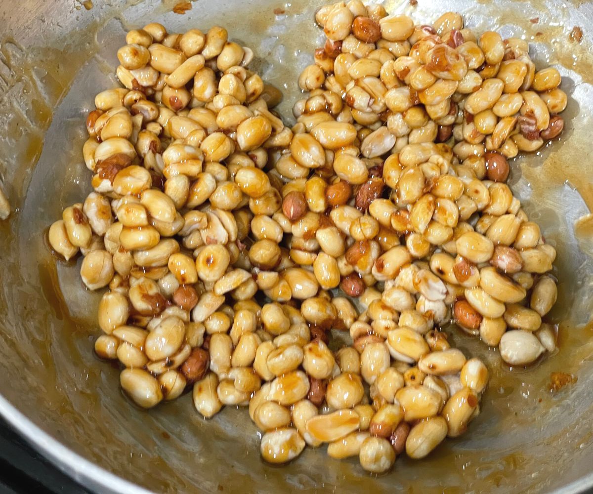 A pan is with peanut jaggery ladoo mixture.