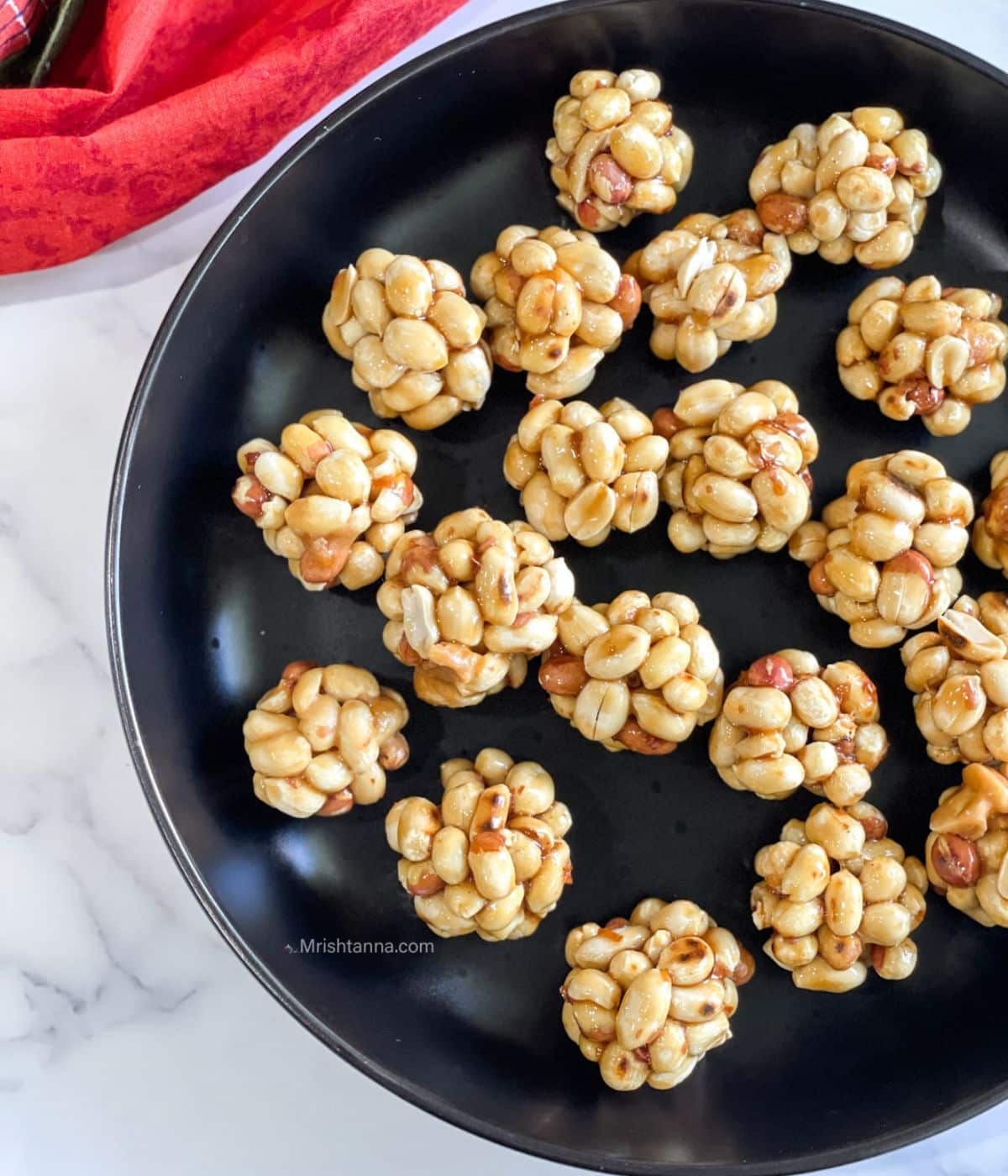 head shot of plate with peanut ladoos.