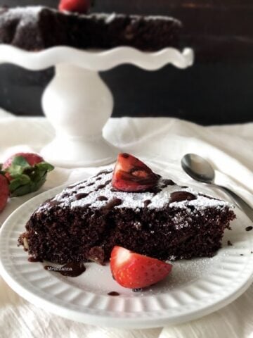 A piece of chocolate cake on a plate, with Semolina