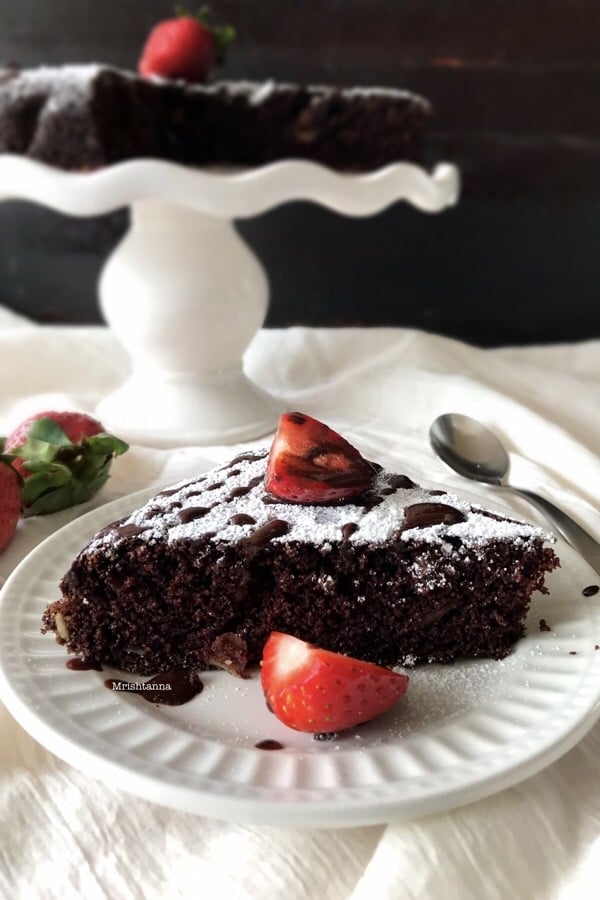 A piece of chocolate cake on a plate, with Semolina