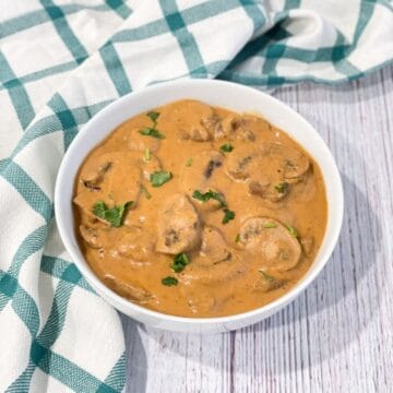 a bowl of mushroom masala is on the table