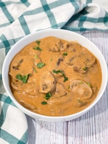 a bowl of mushroom masala is on the table