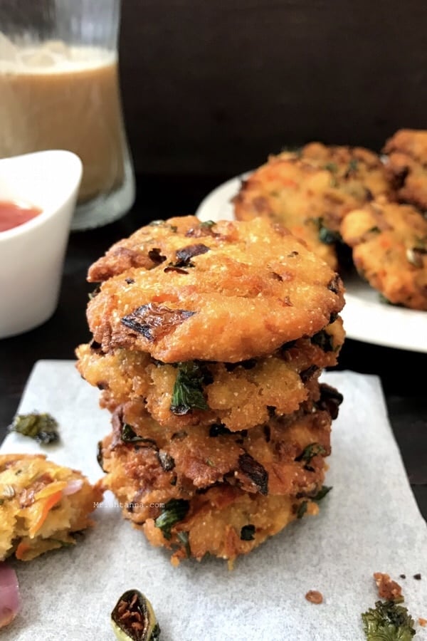 A plate of bread vada is on the table