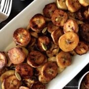 Sliced and roasted sweet plantains on a plate