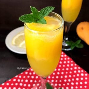 A close up of a glass of mango mocktail