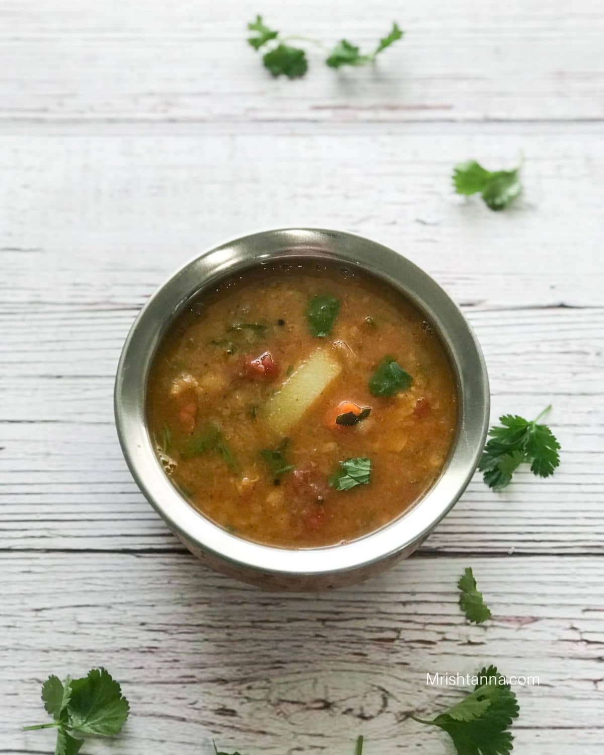 Sambar is on the pot over the table