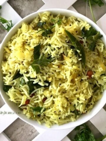 A bowl of mavinakayi chitranna is on the table