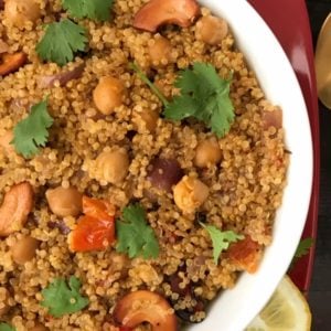 A bowl of quinoa and chana on a plate