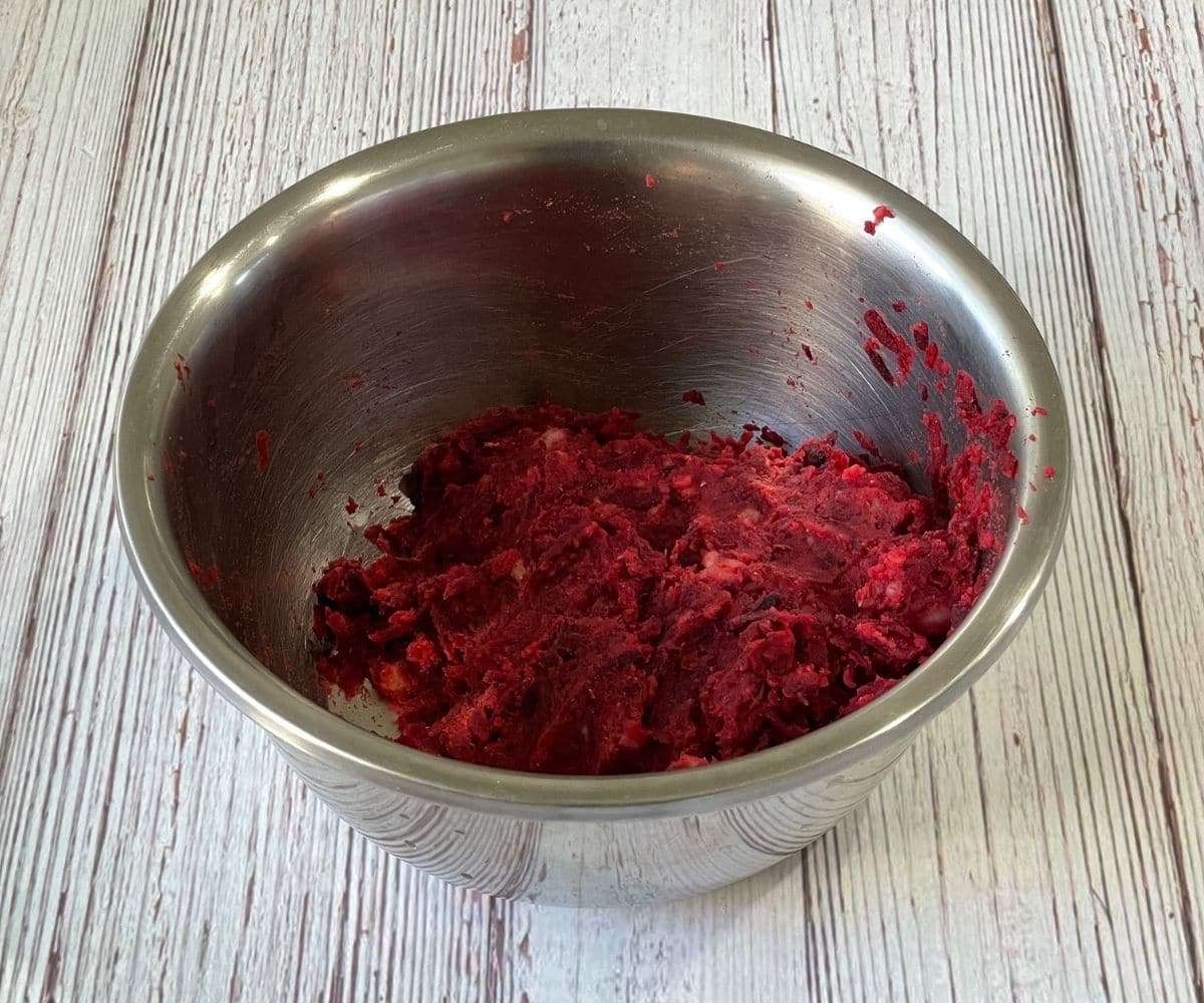 A bowl is with beetroot tikki mixture.