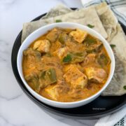 A bowl of Instant pot tofu curry is on the plate.
