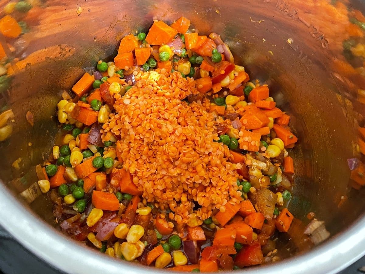 A pot is with vegetables and lentils for khichdi