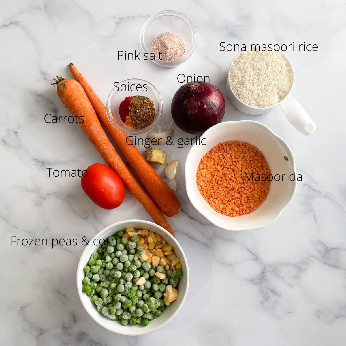 Khichdi ingredients are on the table like peas, corn, carrots, rice and lentils