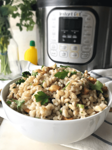 A plate filled with barley salad