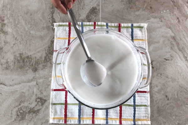 A close up of a bowl, with Neer dosa batter.