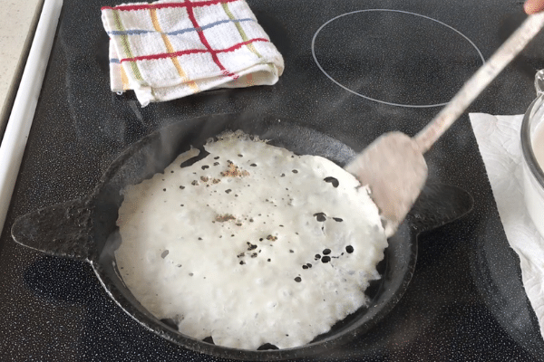 A pan of food, with Neer dosa and Rice