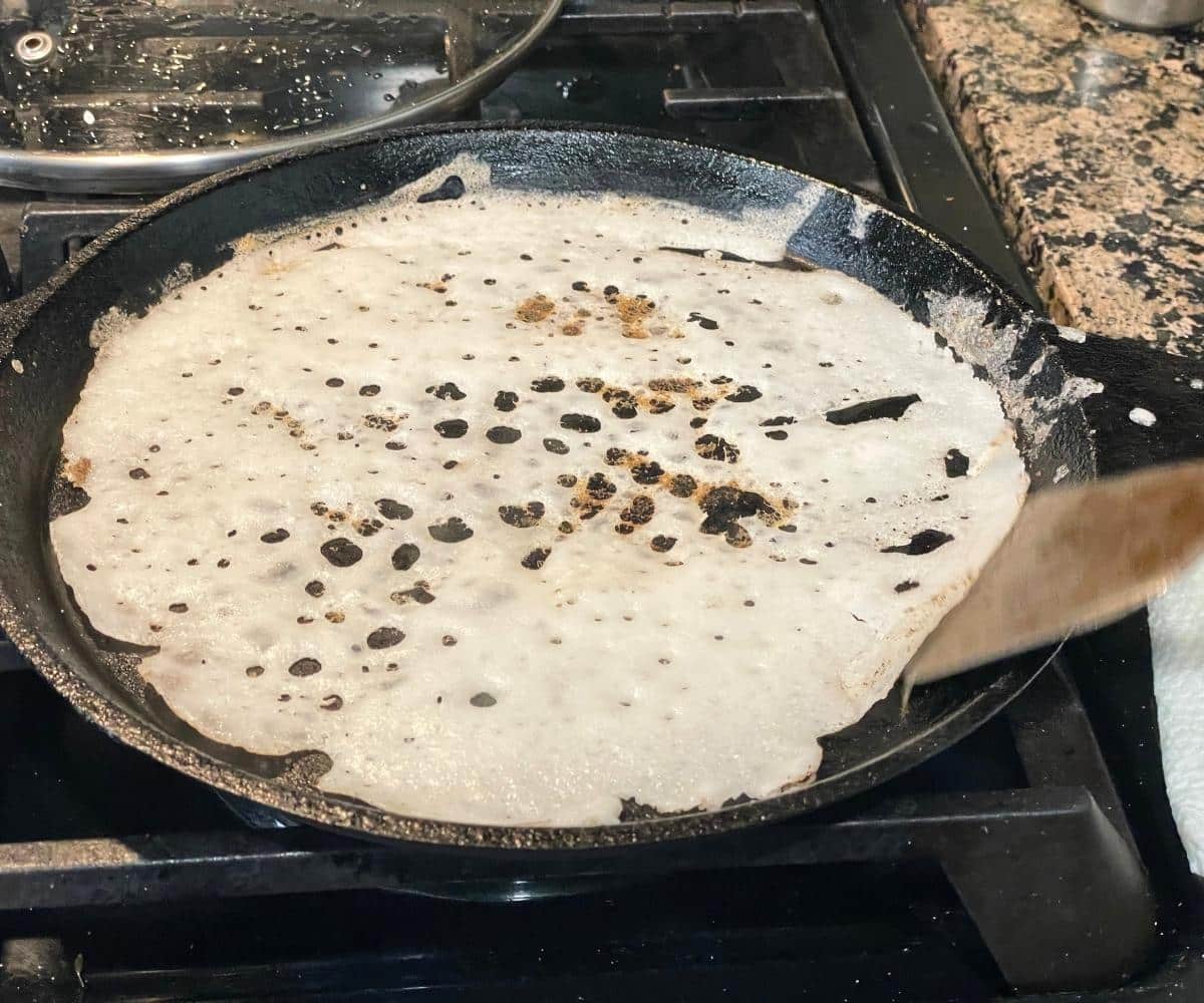 A hot tawa has neer dosa.