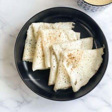 A plate of Mangalore Neer dose is on the table.