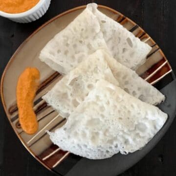 A plate of neer dosa is on the table