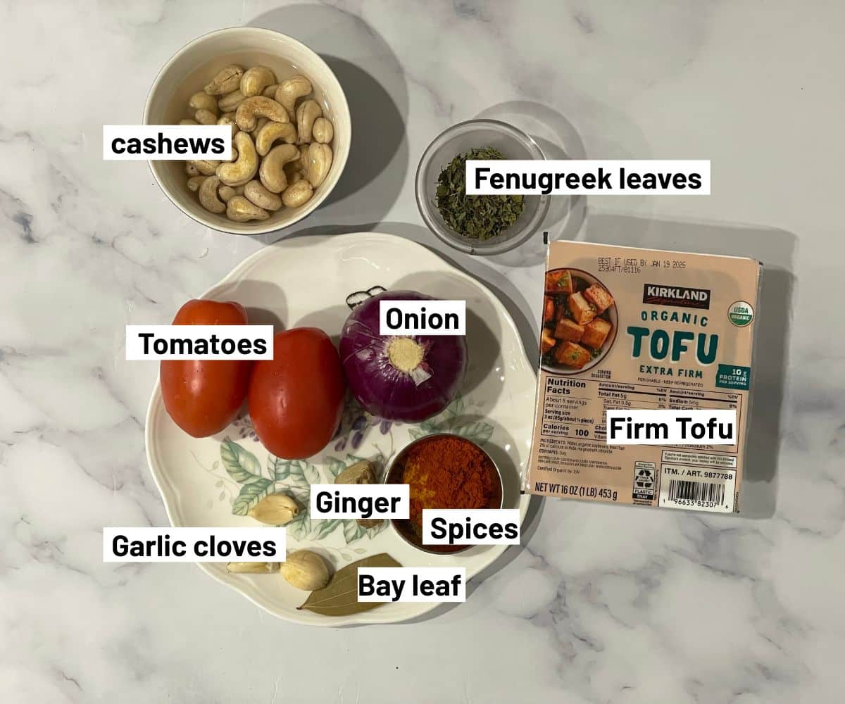a table is with tofu butter masala ingredients.