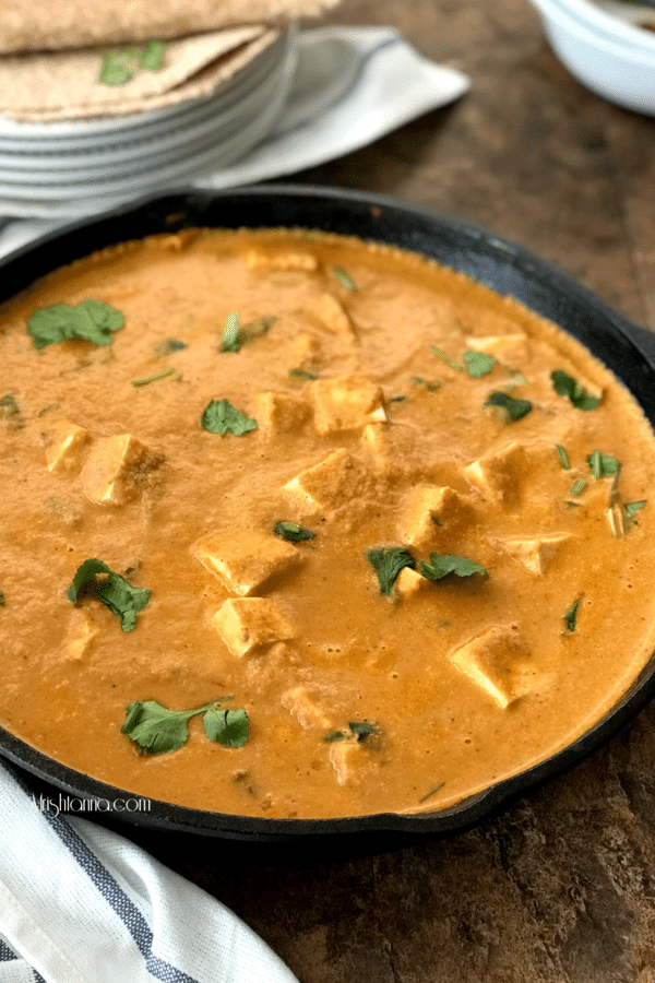 A pan of food on a plate, with Tofu and Gravy