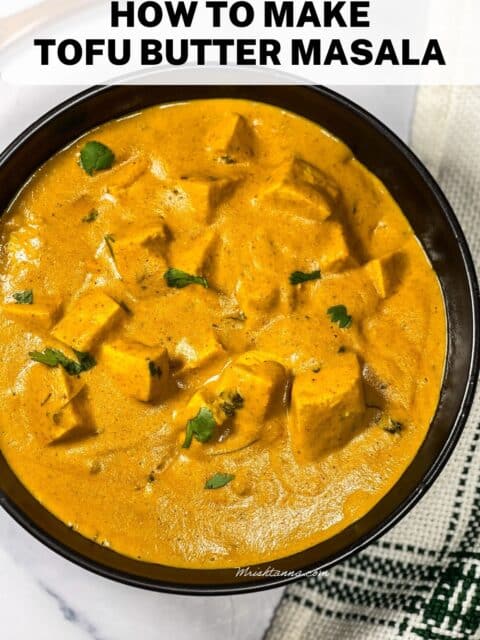 A bowl of vegan tofu butter masala is on the table.