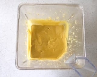 A blender filled with cheesecake batter