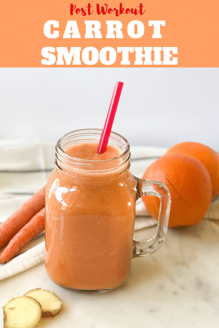 A glass jar is with carrot smoothie and placed on the table