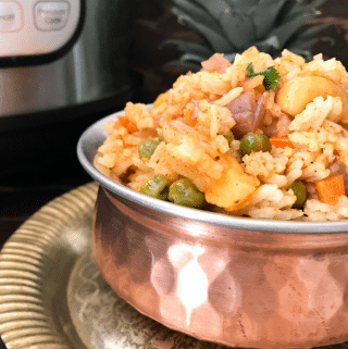 A bowl of food, with Rice