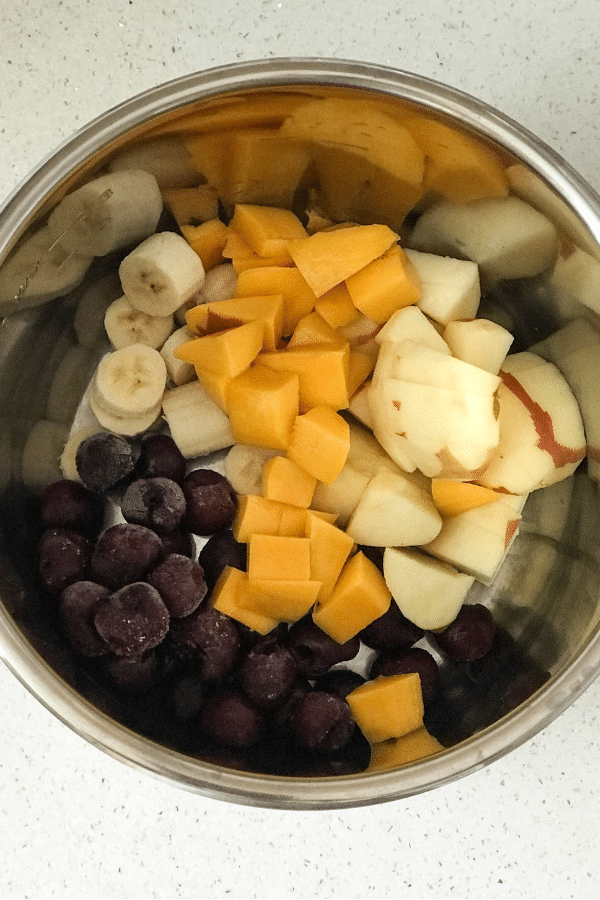 A bowl filled with fruit, with Jam and Pressure cooker