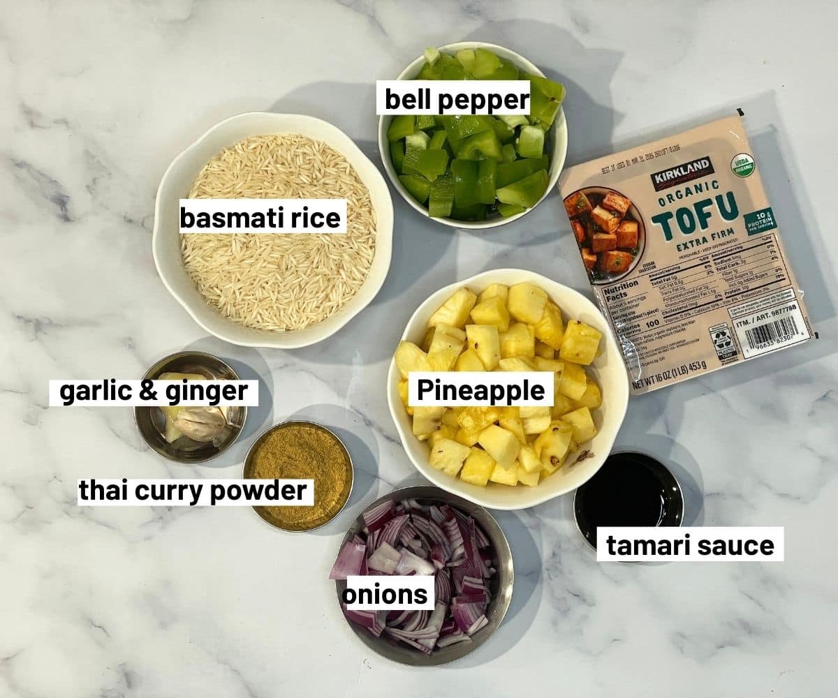 All the ingredients for pineapple fried rice are on the table.