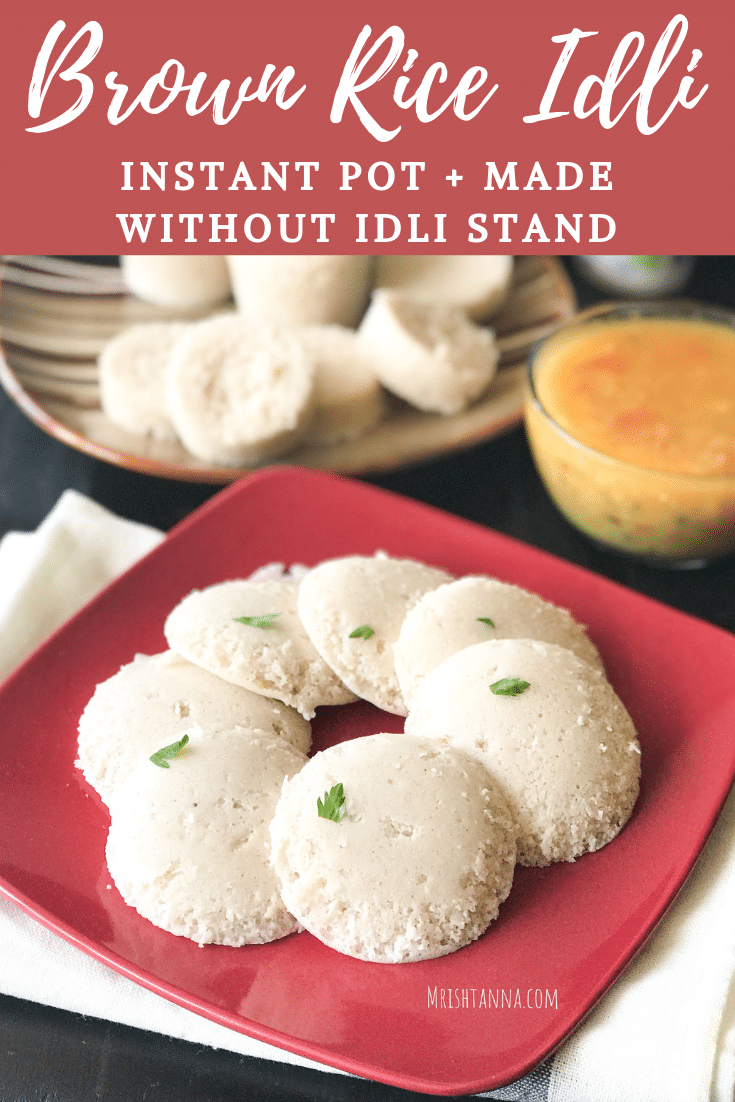 A tray of food on a plate, with Idli and sambar.