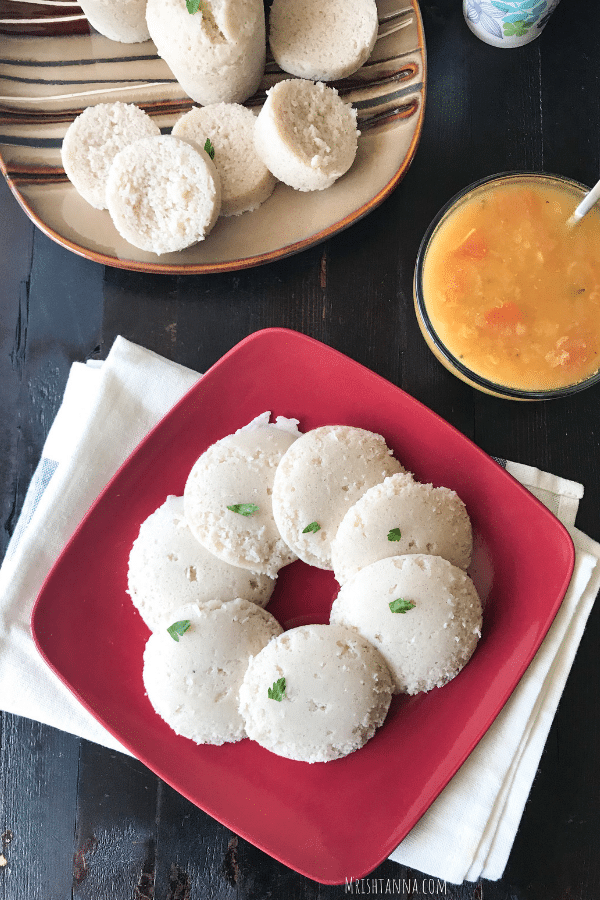 A close up of a batter, with Brown and Idli